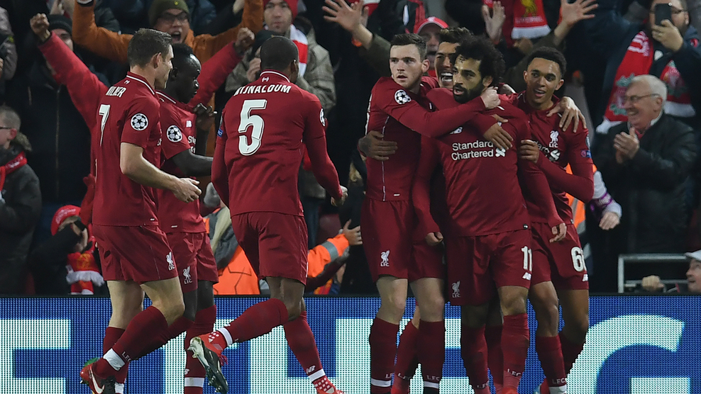 Liverpool's Egyptian midfielder Mohamed Salah (2R) celebrates scoring the opening goal during the UEFA Champions League group C football match between Liverpool and Napoli at Anfield stadium in Liverpool, north west England on December 11, 2018. (Photo by Paul ELLIS / AFP)        (Photo credit should read PAUL ELLIS/AFP/Getty Images)