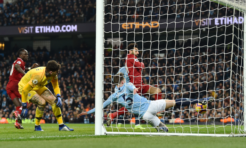 MANCHESTER, ENGLAND - JANUARY 03: (THE SUN OUT, THE SUN ON SUNDAY OUT)  Mohamed Salah of Liverpool with John Stones of Manchester City during the Premier League match between Manchester City and Liverpool FC at Etihad Stadium on January 3, 2019 in Manchester, United Kingdom. (Photo by Andrew Powell/Liverpool FC via Getty Images)