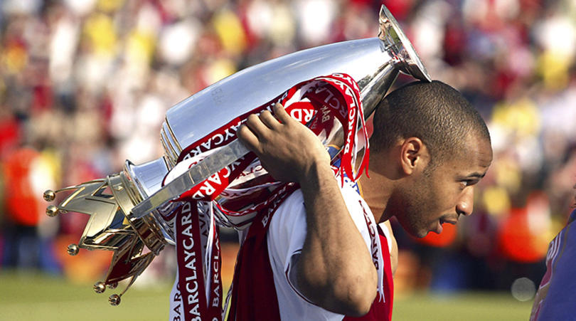 Arsenal's Thierry Henry celebrates with the Premiership trophy