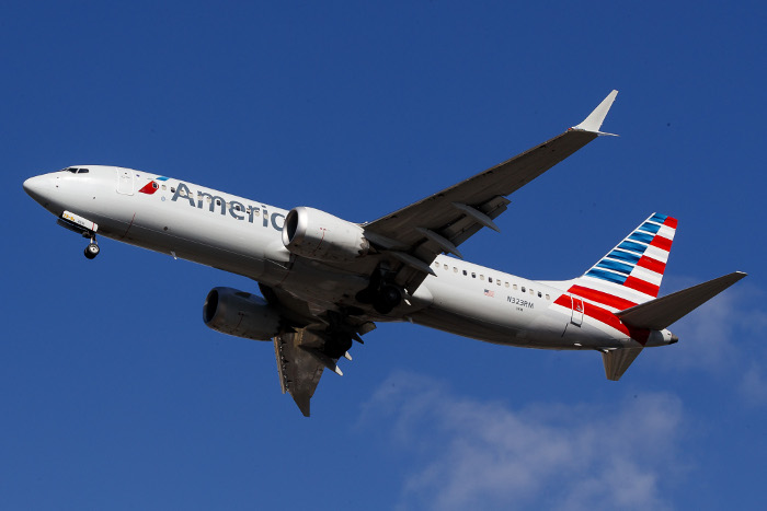 epa07434623 (FILE) - An American Airlines Boeing 737 Max 8 (Tail Number N323RM) lands at LaGuardia Airport in New York, New York, USA, 12 March 2019 (Reissued 13 March 2019). US President Donald J. Trump announced on 13 March 2019 that the US is issuing an emergency order to ground all Boeing 737 Max 8 and 9 and other planes associated with that line. He added that the FAA (Federal Aviation Administration) and Boeing were in agreement with this action.  EPA-EFE/JUSTIN LANE