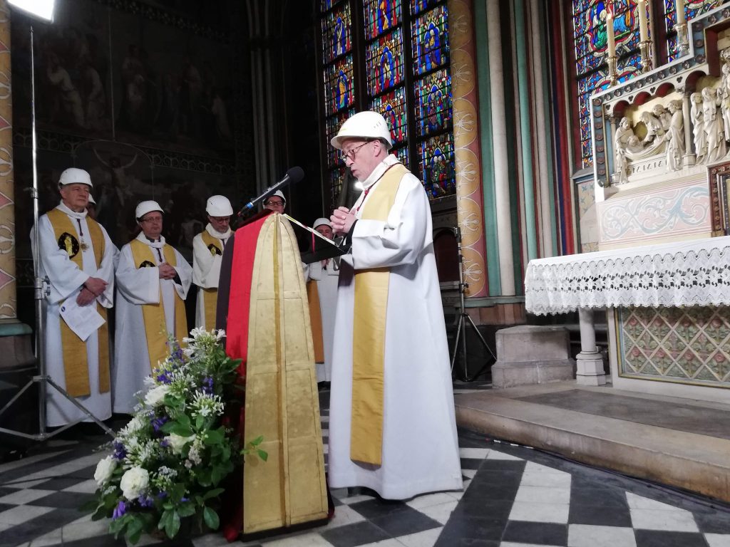 The Notre-Dame de Paris cathedral's rector Patrick Chauvet, speaks during the first mass in a side chapel two months to the day after a devastating fire engulfed the Notre-Dame de Paris cathedral on June 15, 2019, in Paris. - The Notre-Dame cathedral in Paris will host its first mass on June 15, 2019, exactly two months after the devastating blaze that shocked France and the world. For safety reasons, the mass led by Archbishop of Paris Michel Aupetit will be celebrated on a very small scale. Worshippers will be expected to don hard hats but priests will be wearing their ceremonial garb. (Photo by Karine PERRET / POOL / AFP)KARINE PERRET/AFP/Getty Images
