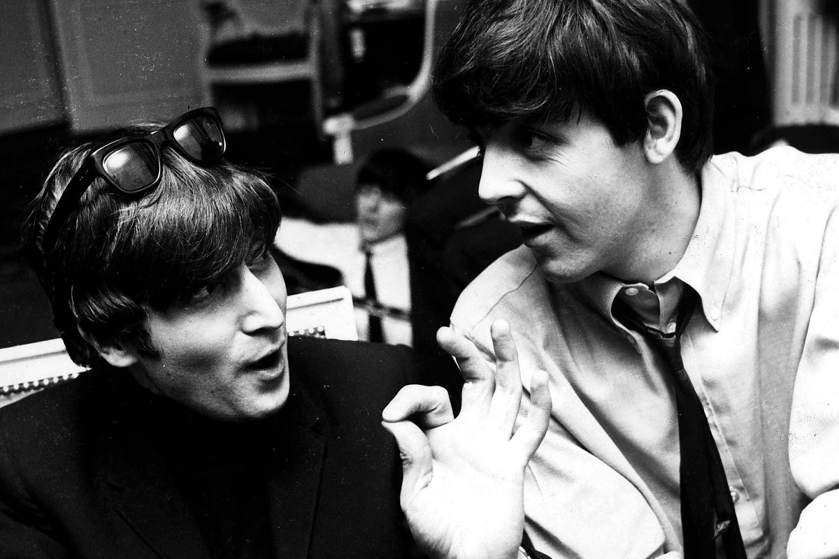 PAUL MCCARTNEY AND JOHN LENNON - PARIS 1964.  (Express Newspapers Via AP Images)