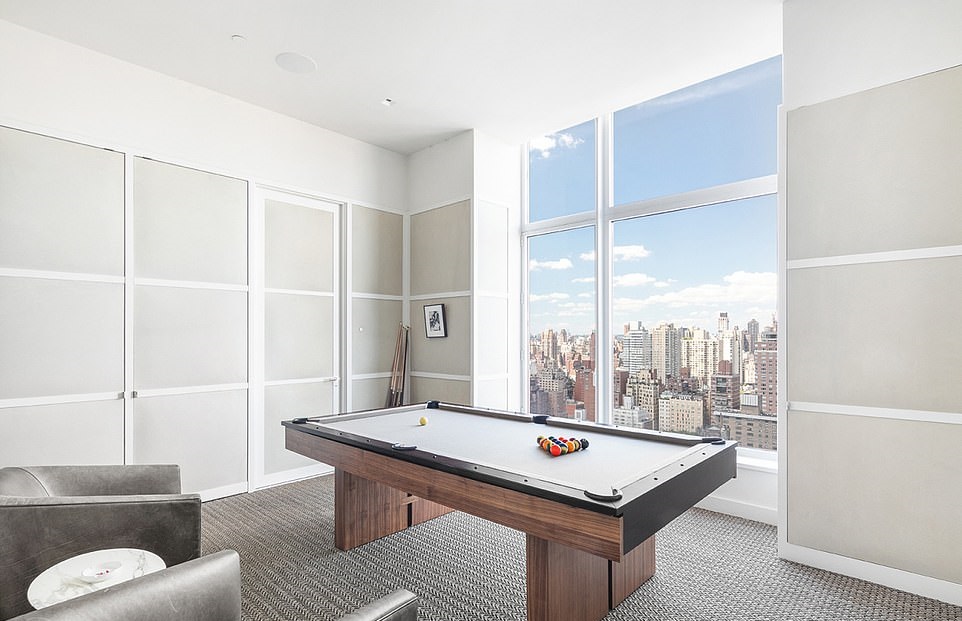 20602542-7649715-Game-on-One-room-featured-a-pool-table-with-yet-another-breathta-a-218-1572917180072