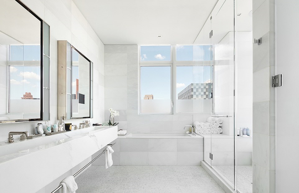 20602544-7649715-Serene-The-bathroom-featured-a-tile-floor-and-glass-encased-show-a-220-1572917180089