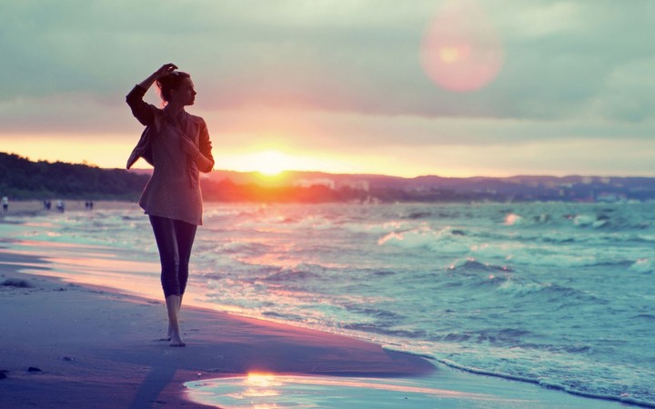 beautiful-girl-walking-on-the-beach-at-sunset
