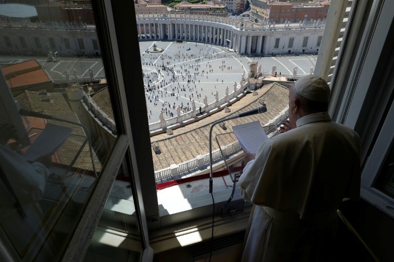 FILE PHOTO: Pope Francis leads the Regina Coeli prayer from his window in the newly reopened St. Peter's Square after months of closure due to an outbreak of the coronavirus disease (COVID-19), at the Vatican, May 31, 2020. Vatican Media/­Handout via REUTERS    ATTENTION EDITORS - THIS IMAGE WAS PROVIDED BY A THIRD PARTY.