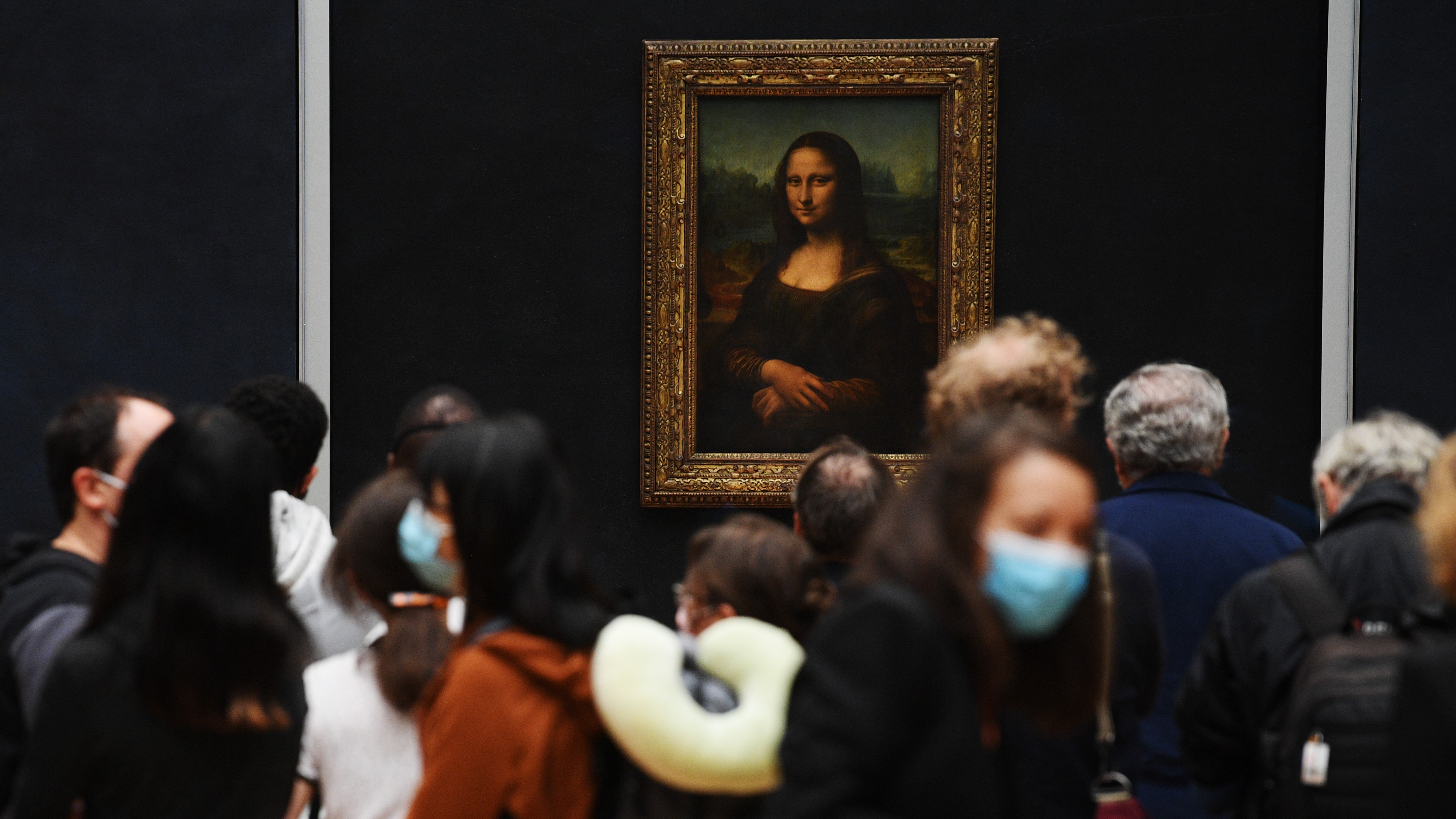 PARIS, FRANCE - JULY 06: Visitors queue observing social distancing marking to see Leonardo da Vinci's 'Mona Lisa' at the Louvre museum as it reopens its doors following its 16 week closure due to lockdown measures caused by the COVID-19 coronavirus pandemic, at the Louvre on July 6, 2020 in Paris, France. (Photo by Pascal Le Segretain/Getty Images)