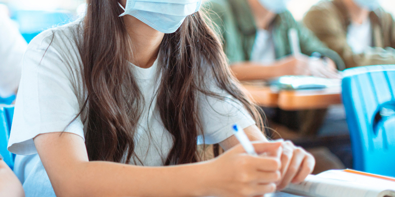 Students wearing  protection mask to prevent germ, virus and PM 2.5 micron in classroom