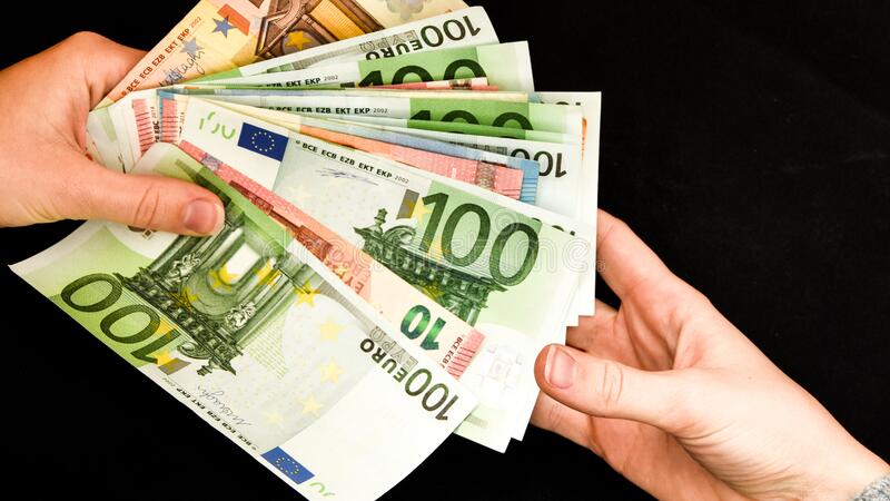 hand-giving-euro-isolated-black-background-holding-euros-trading-business-theme-one-hundred-money-banknotes-currency-european-175268109