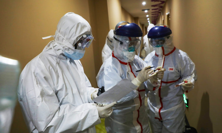 WUHAN, CHINA - FEBRUARY 04 2020: CDC workers check the information during collecting biomaterial from suspected 2019-nCoV patients for nucleic acid tests in a hotel for isolated people in Wuhan in central China's Hubei province Tuesday, Feb. 04, 2020.- PHOTOGRAPH BY Feature China / Barcroft Media (Photo credit should read Feature China/Barcroft Media via Getty Images)