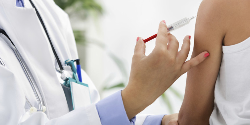 doctor making vaccination to the patient