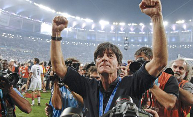 Germany's head coach Joachim Loew celebrates during a victory lap after the World Cup final soccer match between Germany and Argentina at the Maracana Stadium in Rio de Janeiro, Brazil, Sunday, July 13, 2014. Germany won the match 1-0. (AP Photo/Matthias Schrader)