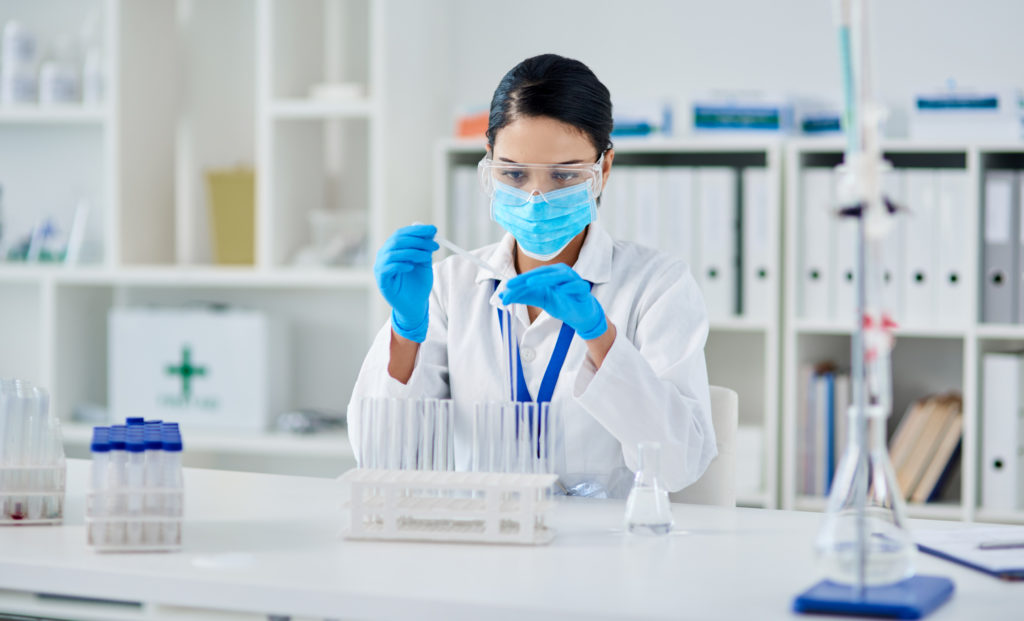 Shot of a young scientist conducting an experiment in a laboratory