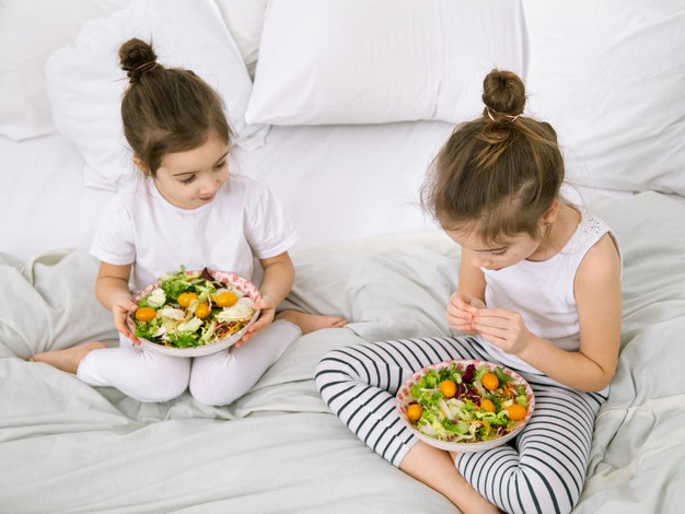 healthy-food-home-happy-two-cute-children-eating-fruits-vegetables-bedroom-bed-healthy-food-children-teenagers-169016-4875