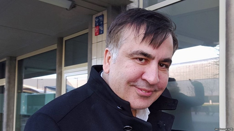 Former Georgian president Mikheil Saakashvili looks on as he stands in front of the Immigration and Naturalisation offices in Rotterdam on february 14, 2018. 
Former Georgian president Mikheil Saakashvili arrived on February 14, 2018 in the Netherlands after being expelled by Ukraine, his lawyer told AFP. Saakashvili, who is married to a Dutch woman, "is in the Netherlands" and "wants to stay," said his lawyer Oscar Hammerstein. He added that the opposition leader, who was arrested by masked men in a Kiev restaurant and deported to Poland, was sorting out a Dutch residency permit.
 / AFP PHOTO / Jan HENNOP