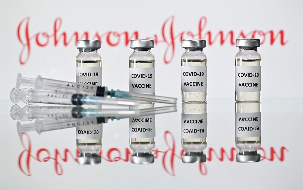 (FILES) A file photo taken on November 17, 2020 shows vials with Covid-19 Vaccine stickers attached and syringes with the logo of US pharmaceutical company Johnson & Johnson. - Johnson & Johnson has applied for authorisation for their coronavirus vaccine in the EU with a decision possible by the middle of March, the European Medicines Agency said on February 16, 2021. (Photo by JUSTIN TALLIS / AFP)