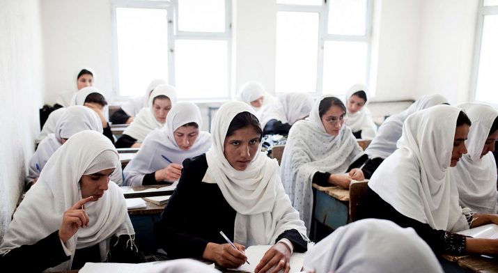 FILE -- Female Afghan students work during a class at the Jamal Agha Girls School in Kapisa Province, Afghanistan, June 29, 2010. The numbers of attacks on schools are down to an average of about eight  a month, less than half the monthly average recorded by the Education Ministry the previous two years. (Adam Ferguson/The New York Times)