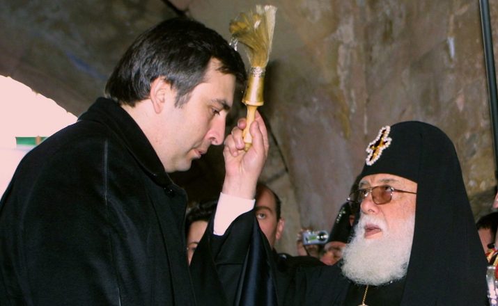 Leader of the Georgian Orthodox Church, Catholicos-Patriarch Ilya II blesses Georgia's President-elect Mikhail Saakashvili during a spiritual swearing-in for Mikhail Saakashvil at the grave of David the Builder in the Gelati Monastery outside Kutaisi (about 250km northwest of the Georgian capital Tbilisi), Saturday 24 January 2004. Saakashvili launched his inaugural weekend Saturday with a deeply symbolic exercise, taking a spiritual oath beside the grave of David the Builder, a king who increased Georgia's wealth and prestige in the 12th century.  EPA/BESO KEZERASHVILI