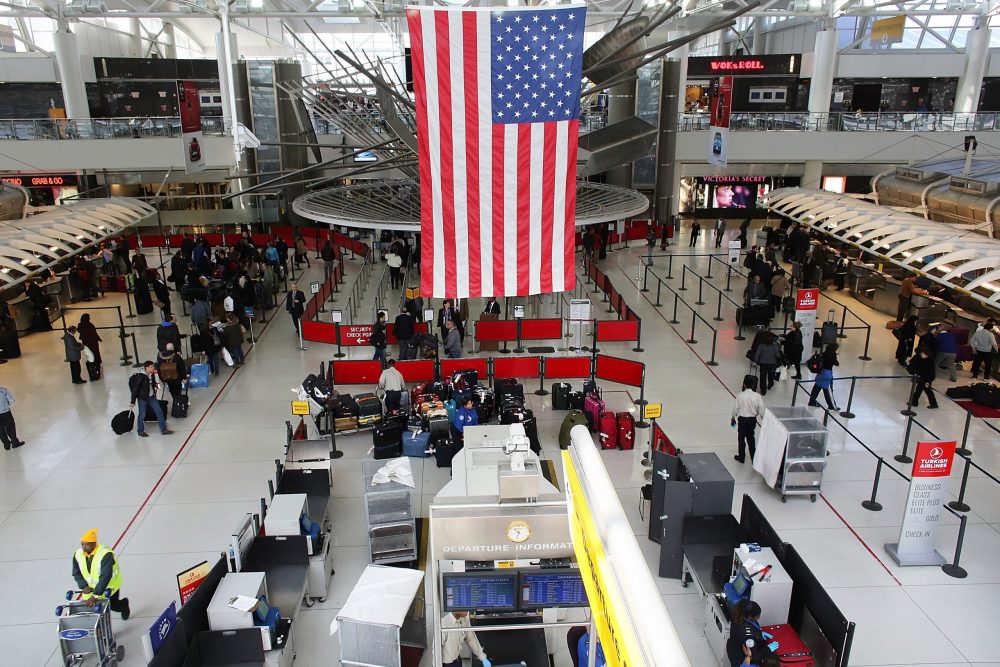 NEW YORK, NY - FEBRUARY 28: People wait in a security line at John F. Kennedy Airport on February 28, 2013 in New York City. Should the $85 billion in automatic federal budget cuts, known as the sequester, go into effect Friday as scheduled, airport control towers in a number of states could close, putting pilots and staff members at risk. In addition to the closed control towers, Transportation Security Administration (TSA) workers could be furloughed, leading to long waits and confusion at many airport security checkpoints.  (Photo by Spencer Platt/Getty Images)