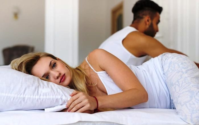 Young Couple Lying In Bed, Having Conflict Problem, Sad Negative Emotions Hispanic Man And Woman Lovers In Bedroom; Shutterstock ID 509605213