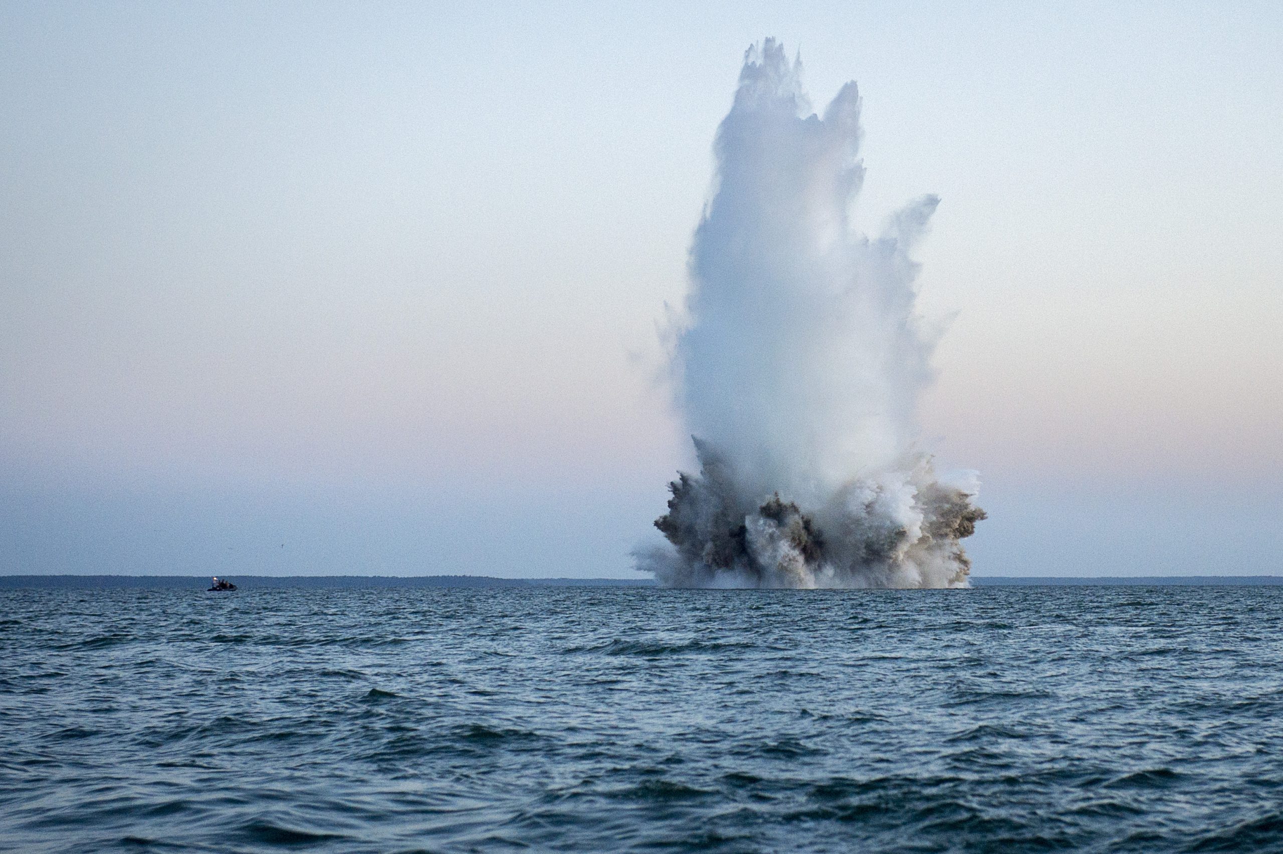 150525-N-RA981-223 
BALTIC SEA (May 25, 2015) Members of a Latvian explosive ordnance disposal team use demolition charges to detonate a World War II-era German bottom-mine while conducting mine countermeasures operations in the Baltic Sea off the coast of Estonia during Exercise Open Spirit 2015. EODMU-8 is working in conjunction with explosive ordnance disposal teams from Estonia, Germany, Latvia, Lithuania, Poland and Sweden to dispose of unexploded ordnance originating from World War II. (U.S. Navy photo by Mass Communication Specialist 2nd Class Patrick A. Ratcliff/Released)