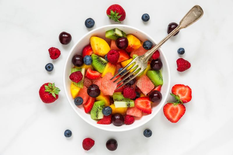 fruit-salad-watermelon-strawberry-cherry-blueberry-kiwi-raspberry-peaches-fork-bowl-fruit-salad-watermelon-125285140