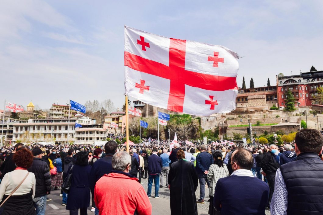 tbilisi-georgia-9th-april-2021-people-holding-georgian-flag-in-street-in-peaceful-protest-free-photo