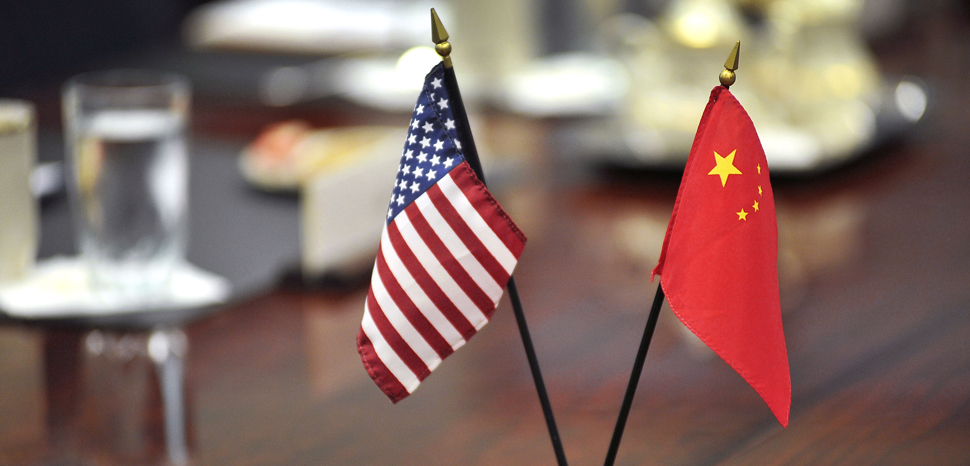 The American and Chinese flags stand at center table shortly before Deputy Secretary of Defense Ashton B. Carter welcomes Deputy Chief of the General Staff of the People's Liberation Army Cai Yingting of China to a meeting at the Pentagon, August 23, 2012. (DoD Photo By Glenn Fawcett)