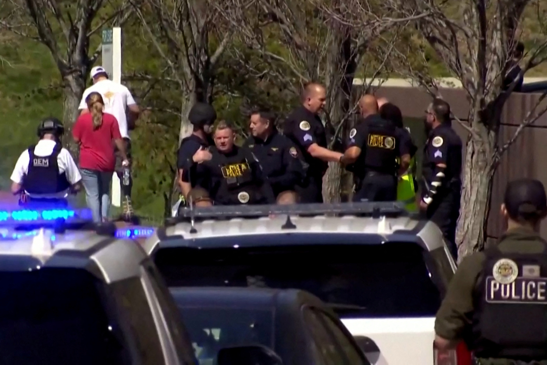 Law enforcement officers assemble near the Covenant School after a shooting in Nashville, Tennessee, U.S. March 27, 2023 in a still image from video.  WKRN/NewsNation via REUTERS