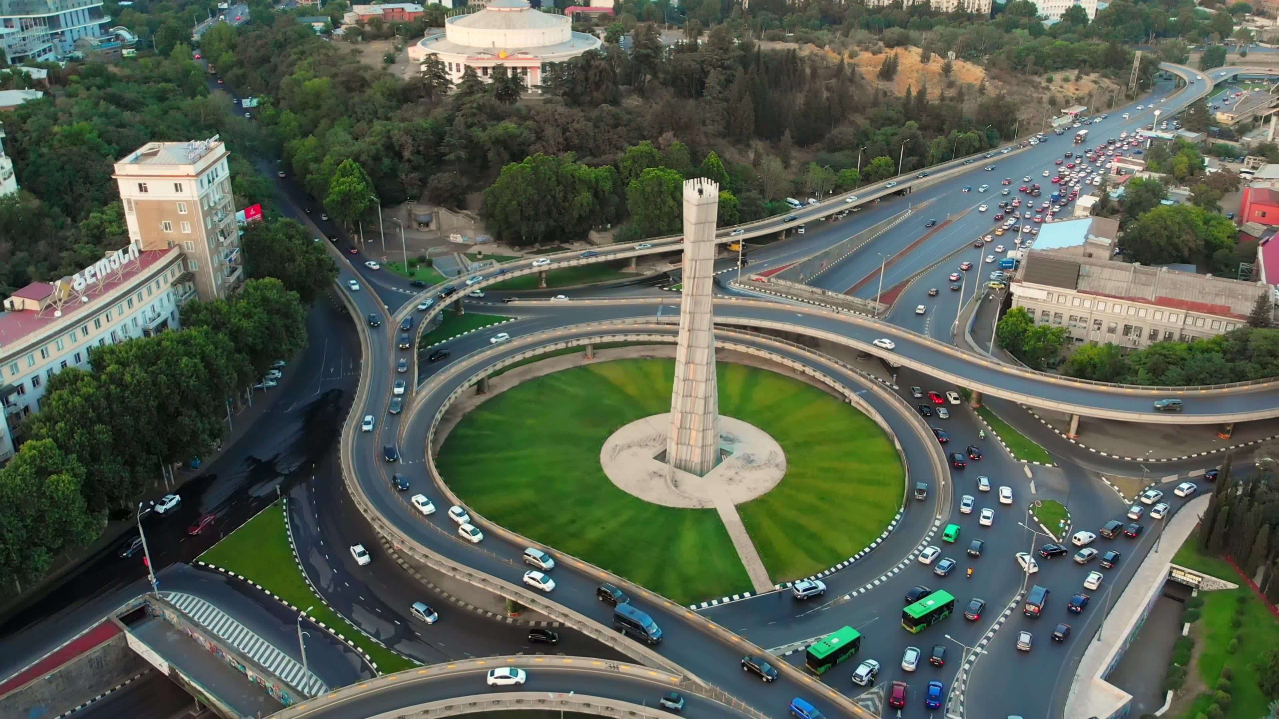 tbilisi-georgia-2022-aerial-view-automobiles-in-traffic-on-roundabout-in-tbilisi-center-square-of-heroes-monument-free-video